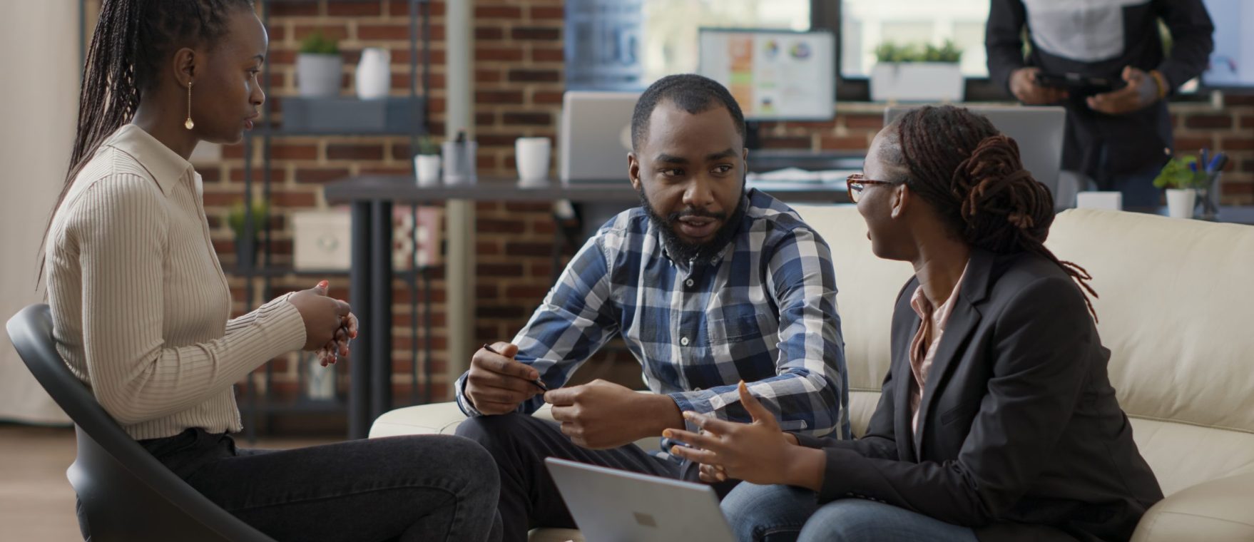 Team of business people collaborating to plan financial strategy, doing teamwork to create sales report on laptop. Office employees working on project strategy to analyze career growth.